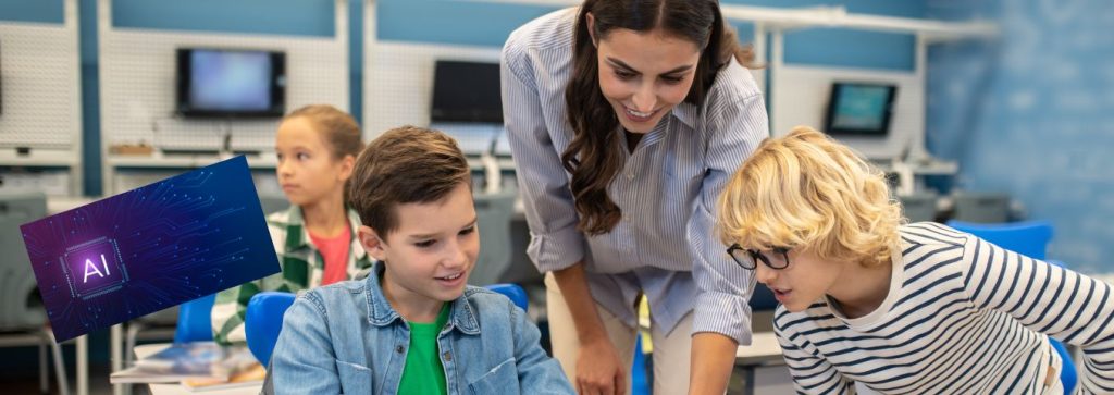 Nauczycielka rozmawia z dwoma uczniami podczas lekcji informatyki. Obok widnieje skrót AI.